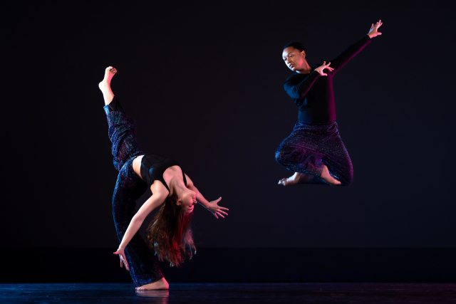 Two women dancing on a stage