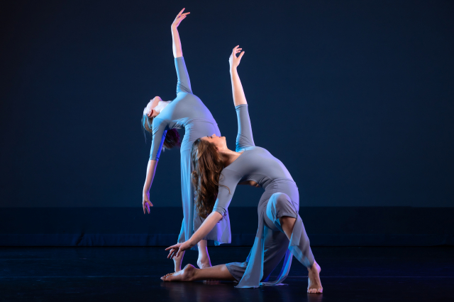 two women dancing in dresses